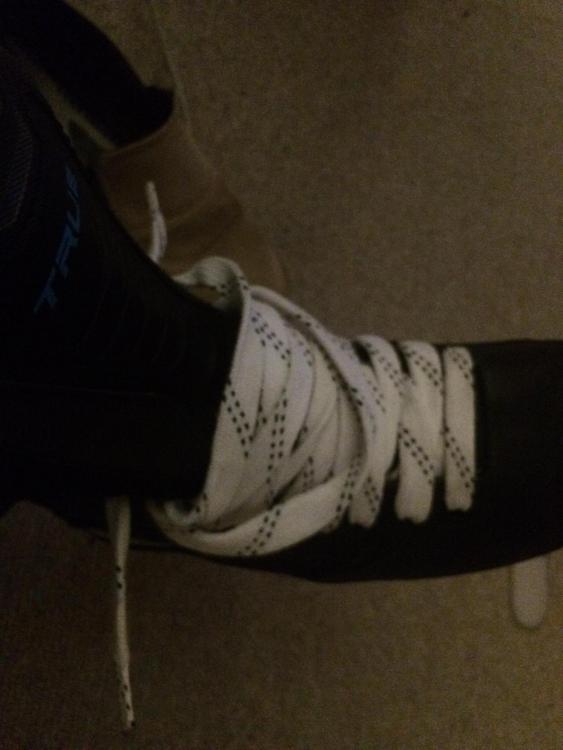 Skates put on and off with laces all the way up.JPG